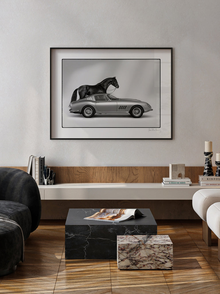 interior with a framed artwork o Black and white fine art photograph of a black horse next to a Ferrari, part of Paul Fuentes’ Black & White Collection.