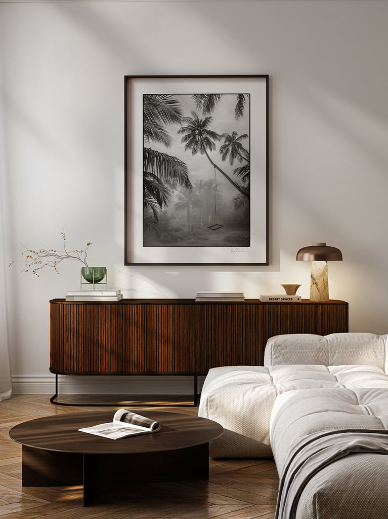 framed artwork. Black and white fine art photograph of a misty jungle filled with palm trees and a swing, part of Paul Fuentes’ minimal and elegant Black & White Collection.
