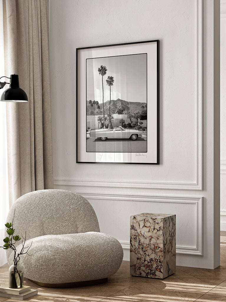 framed artwork of The Morse House, Black and white fine art photograph of a Cadillac in front of a modern Palm Springs house, part of Paul Fuentes’ Black & White Collection. palm trees and mountains in the background
