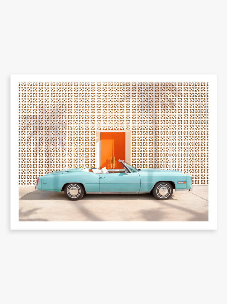 Art print of a light blue Cadillac parked in front of The Parker hotel in Palm Springs, fine art photograph by Paul Fuentes.
