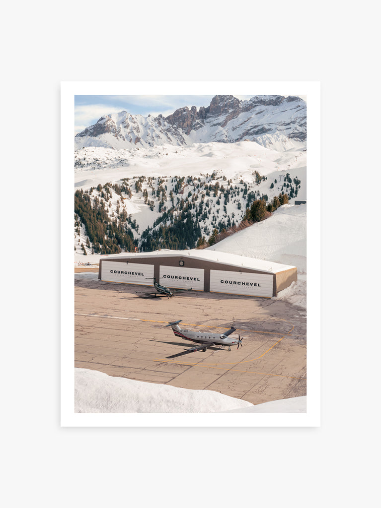 Plane landing on a mountain runway of courchevel airport, a cinematic fine art print by Paul Fuentes.