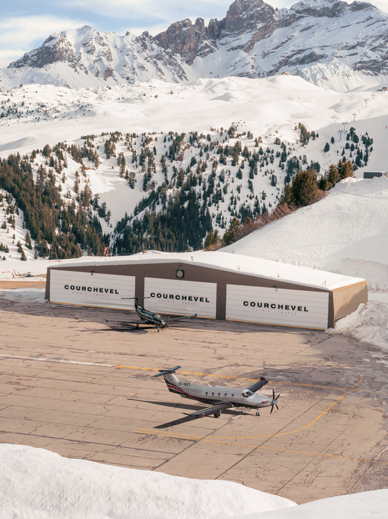 Plane landing on a mountain runway of courchevel airport, a cinematic fine art print by Paul Fuentes.