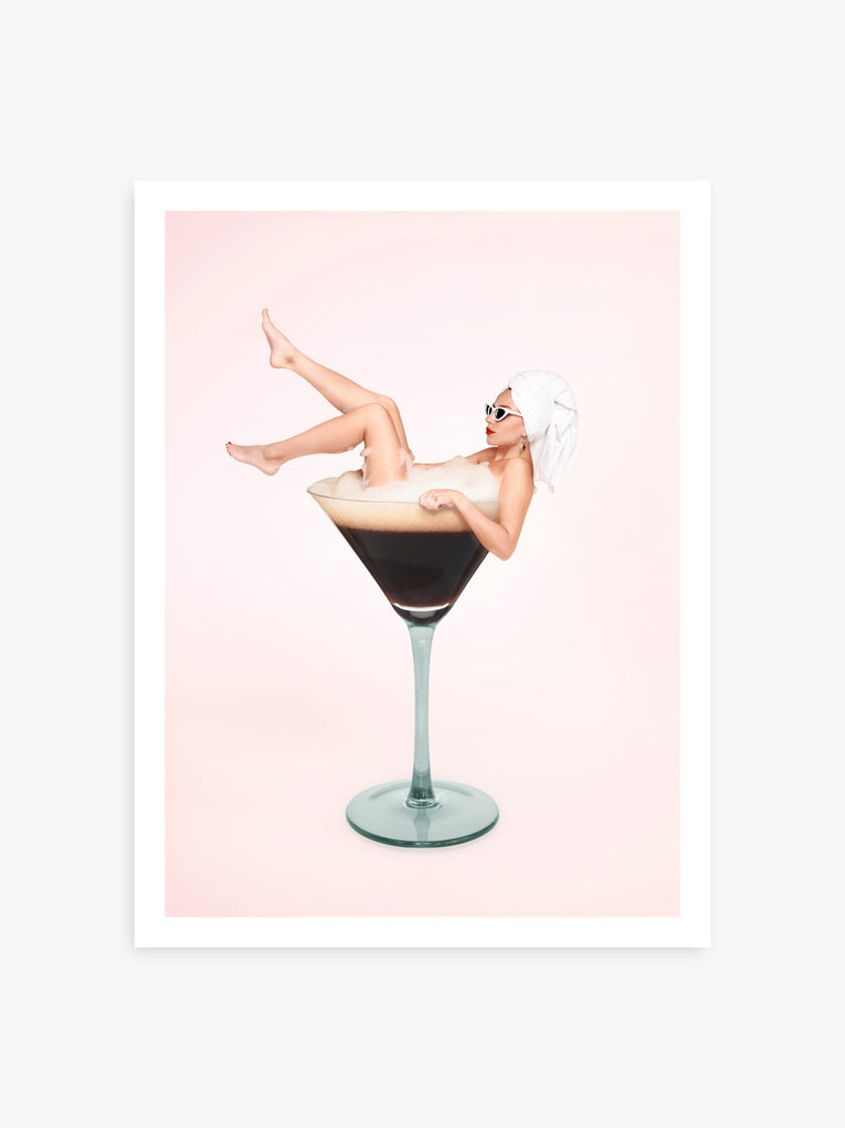 Espresso Martini art print by Paul Fuentes with a vintage lady bathing in an espresso martini cocktail on a pastel pink background.