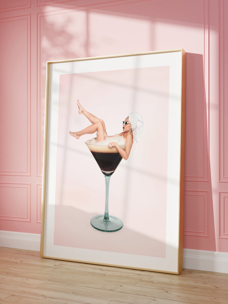 Espresso Martini art print by Paul Fuentes with a vintage lady bathing in an espresso martini cocktail on a pastel pink background.