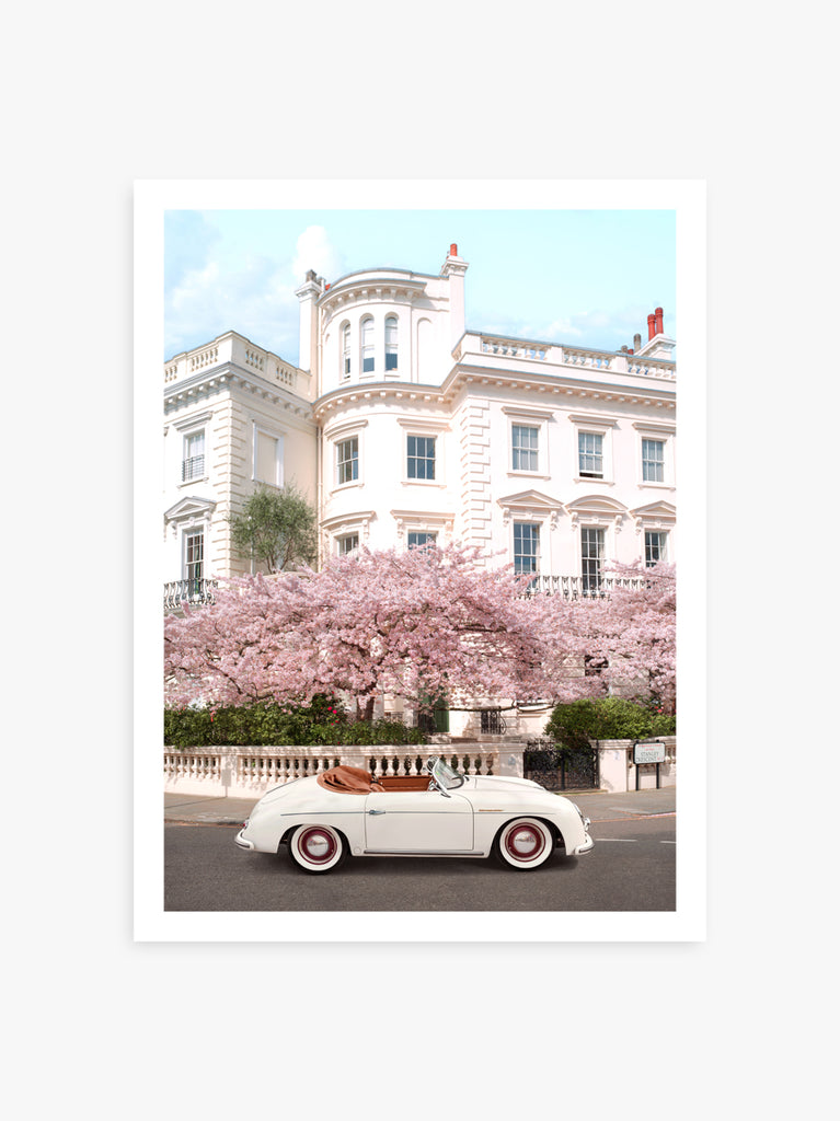 art print by Paul Fuentes featuring a classic porche car on a london street with cherry blossoms in the background.