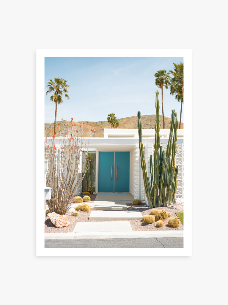 blue door at Palm Springs mid century home with palmtrees and cactus, fine art photography by Paul Fuentes.