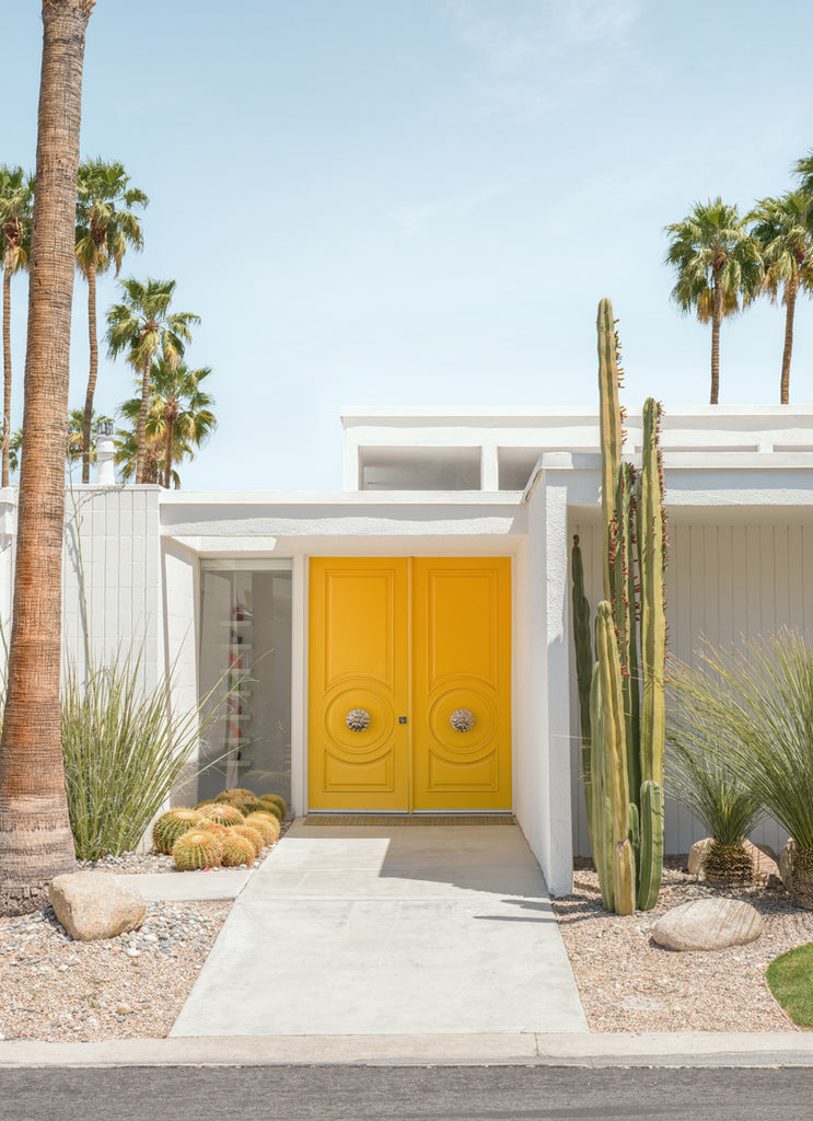 yellow door at mid century home in Palm springs photographed by Paul Fuentes