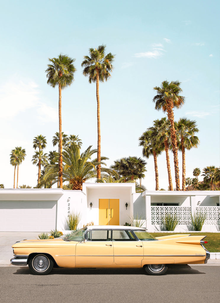 Yellow vintage car parked outside a Palm Springs mid-century house, fine art photography print by Paul Fuentes.