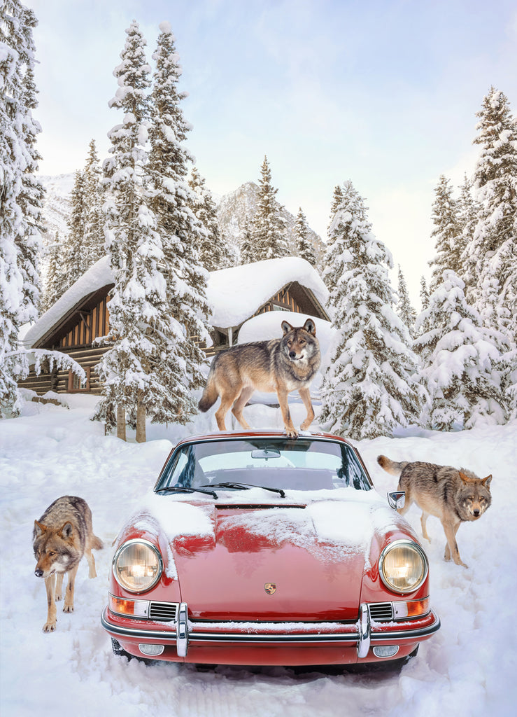 photograph by Paul Fuentes featuring three wolves standing on top of a red Porsche car, with snow and a forest in the background.