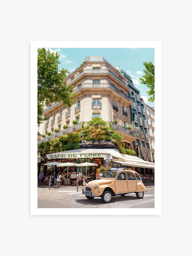 art print by Paul Fuentes featuring a classic image of the Cafe de Flore in Paris with a vintage car parked in front. 