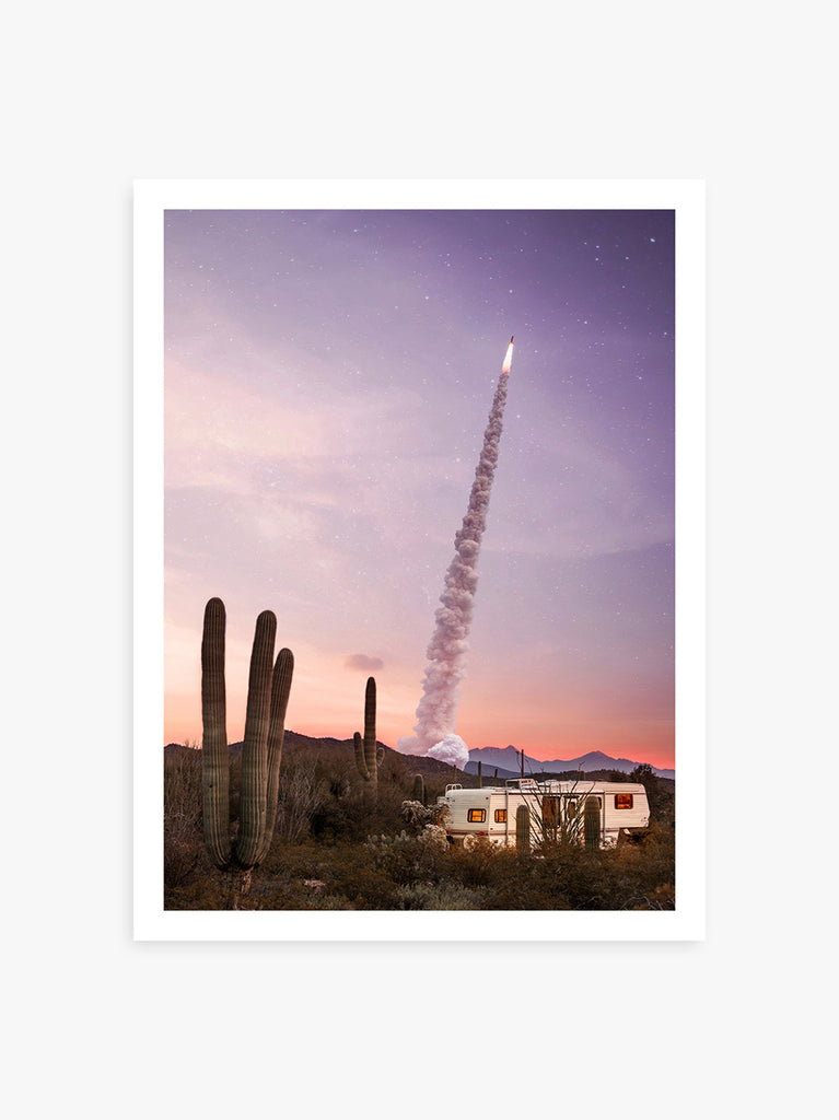 art print of Caravan and rocket in the Mojave Desert with purple sky, fine art photography by Paul Fuentes.
