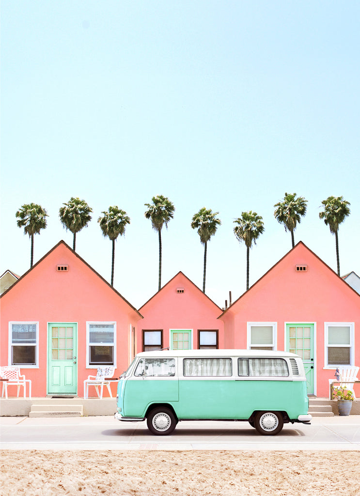 Fine art photography featuring pink beach cottages and a vintage green volkswagen car with palm trees in the background, by Paul Fuentes