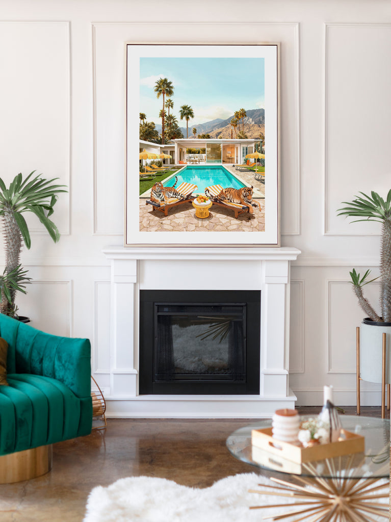 Framed artwork of a fine art print by Paul Fuentes of ttigers lying by a poolside in Palm Springs with palm trees in the background, inspired by an iconic work of Slim Aarons ‘Poolside Glamour'.