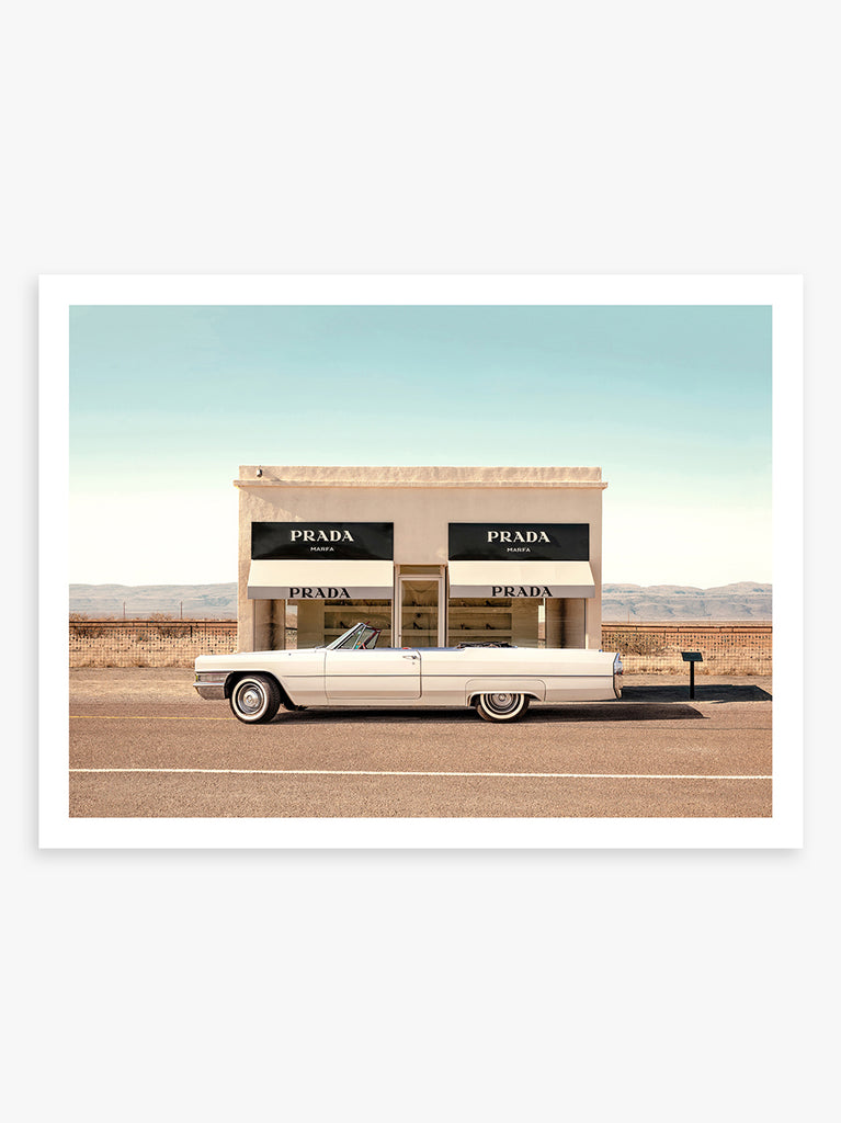 Classic car parked near Prada Marfa sculpture in Texas desert, fine art photography by Paul Fuentes.