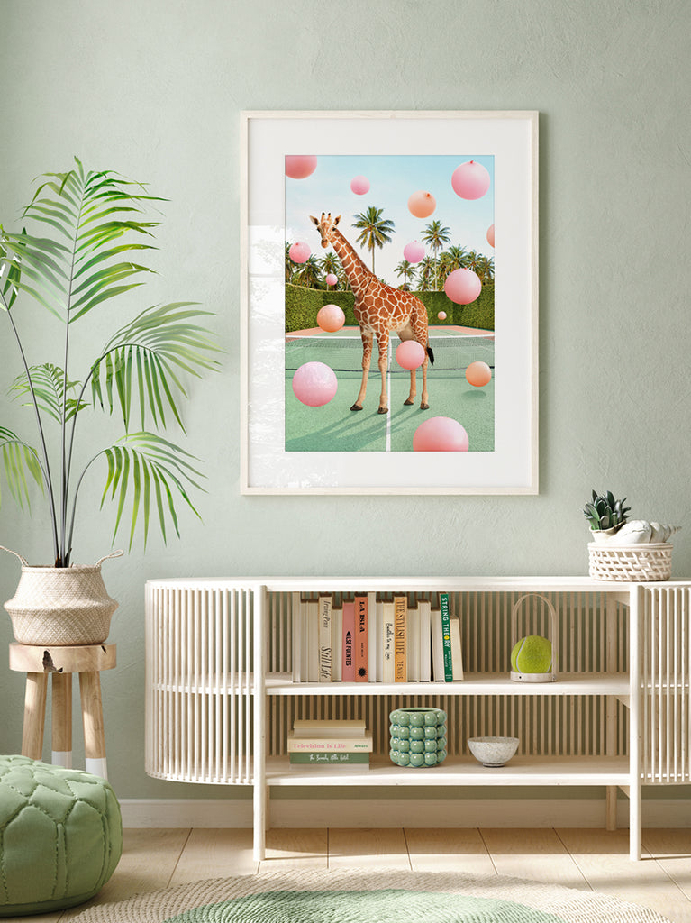 framed artwork of a Giraffe on a tennis court with pastel balloons, fine art photography print by Paul Fuentes.