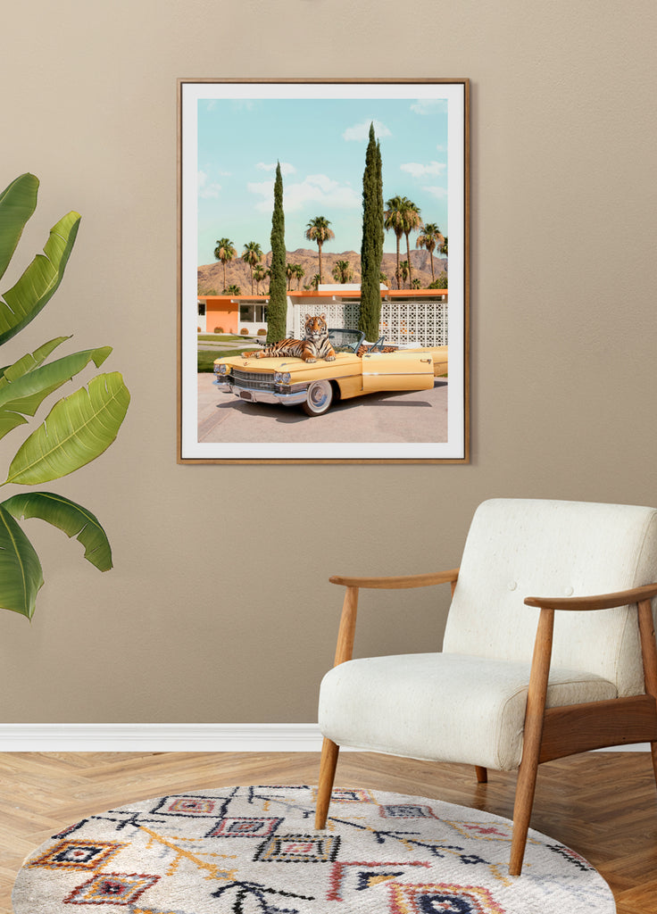 framed artwork of a Tiger laying on a vintage yellow car in Palm Springs, fine art photography by Paul Fuentes.