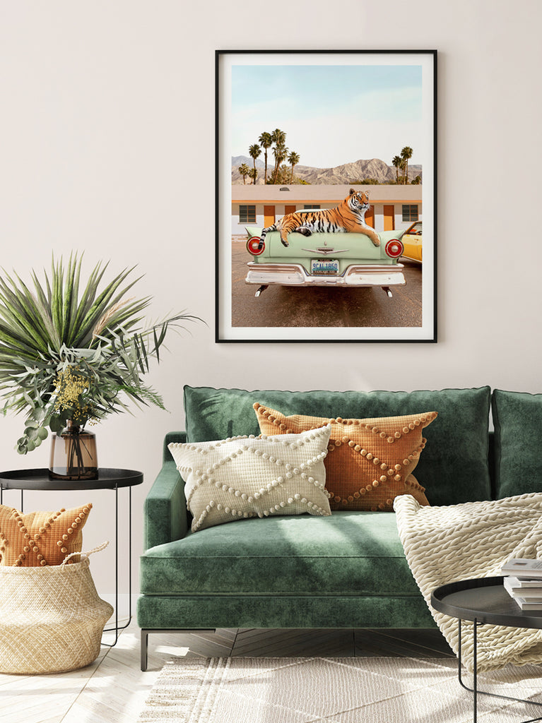 Framed artwork of a retro art print of a Tiger on top of a classic car in front of a  roadside motel in Palm Springs, California, surreal fine art print by Paul Fuentes. 